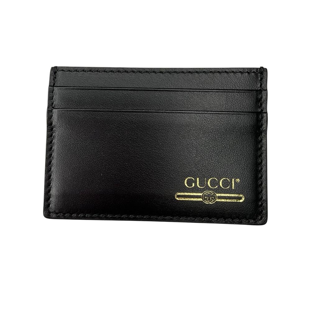 299. Gucci Black & Gold 4-slot Card Holder